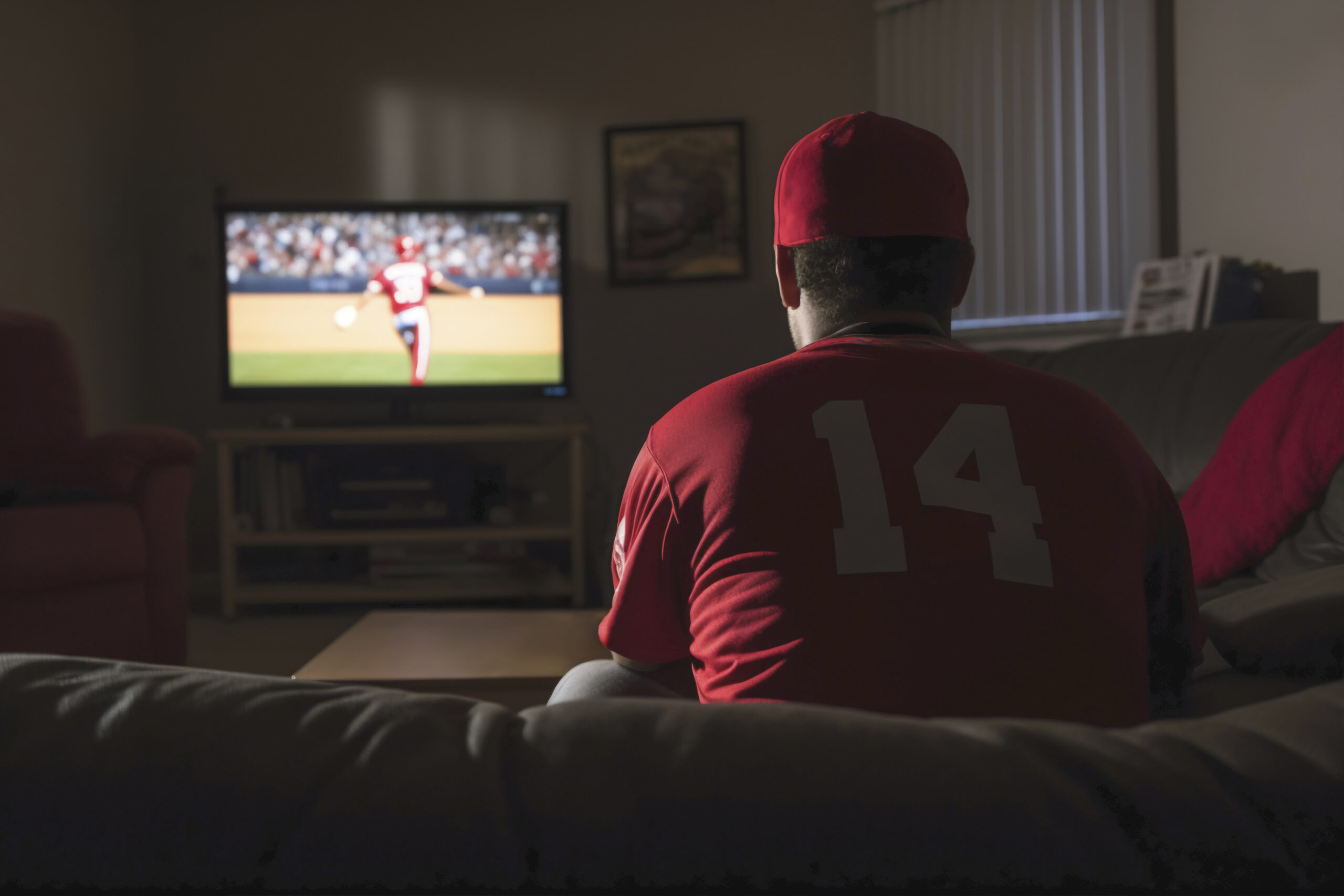 Man watching IPTV on television at home