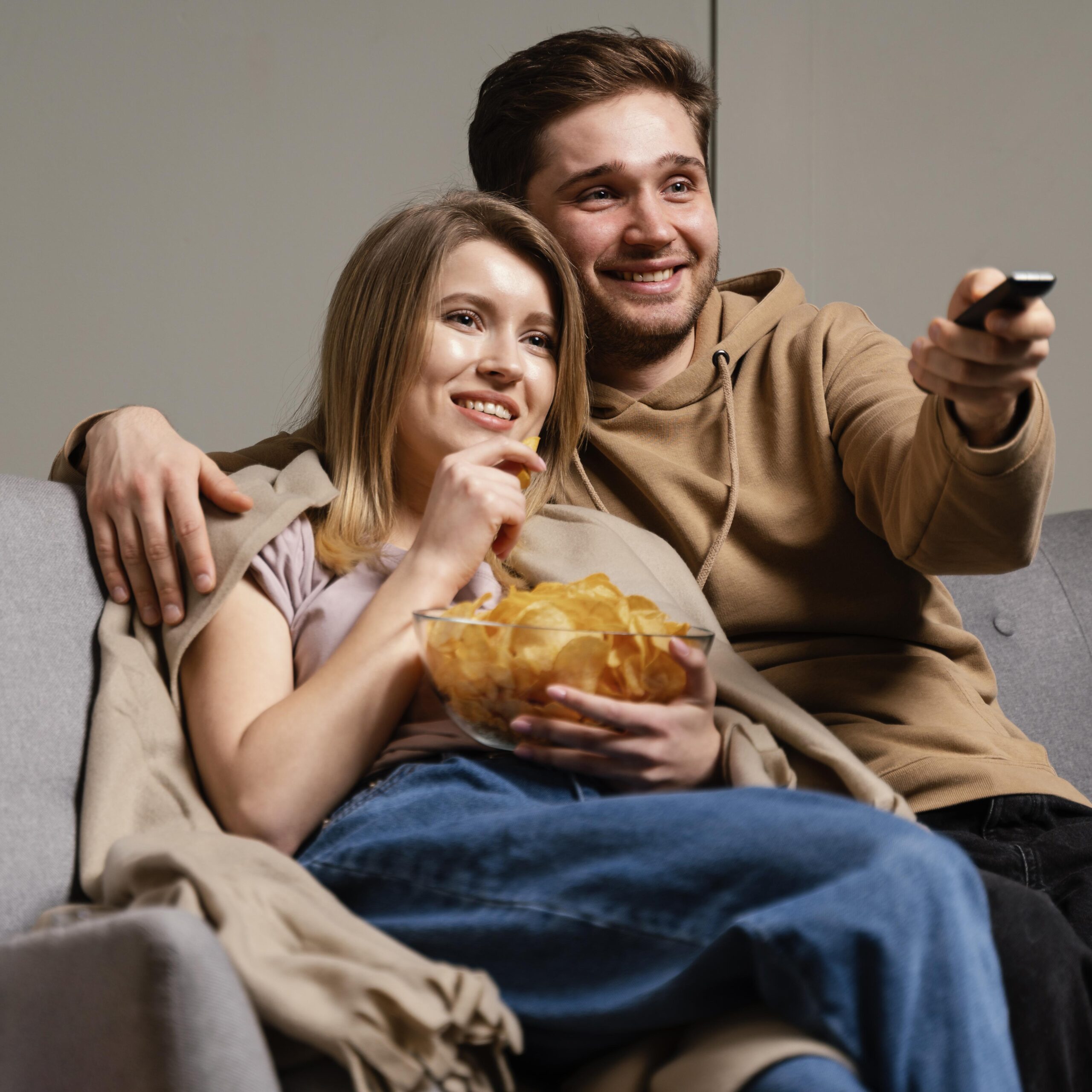 Family enjoying streaming Netflix, HBO, and more on Infinity IPTV at home